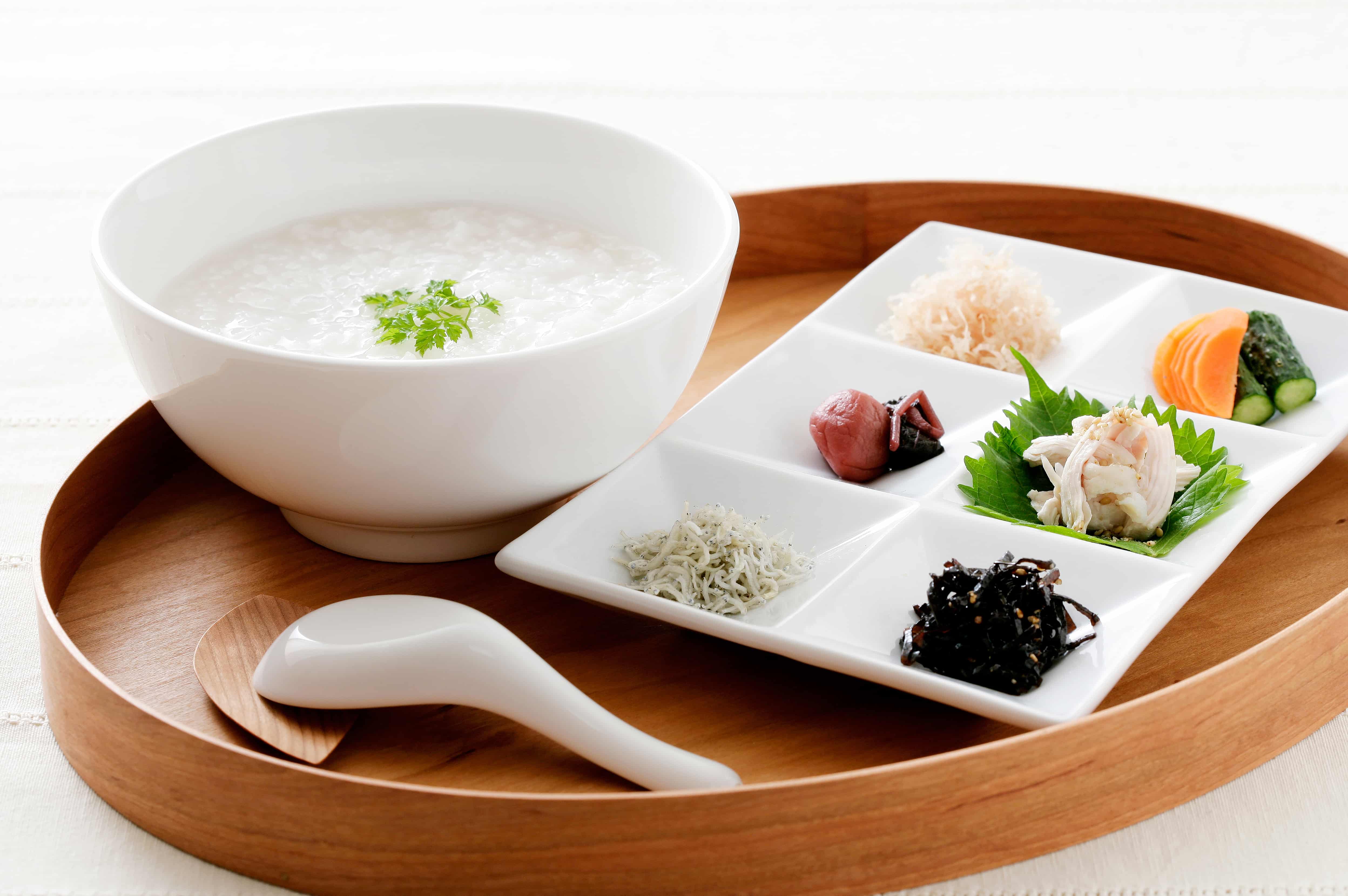 A traveler consulting a doctor online from their hotel room using HOTEL de DOCTOR 24 telemedicine service